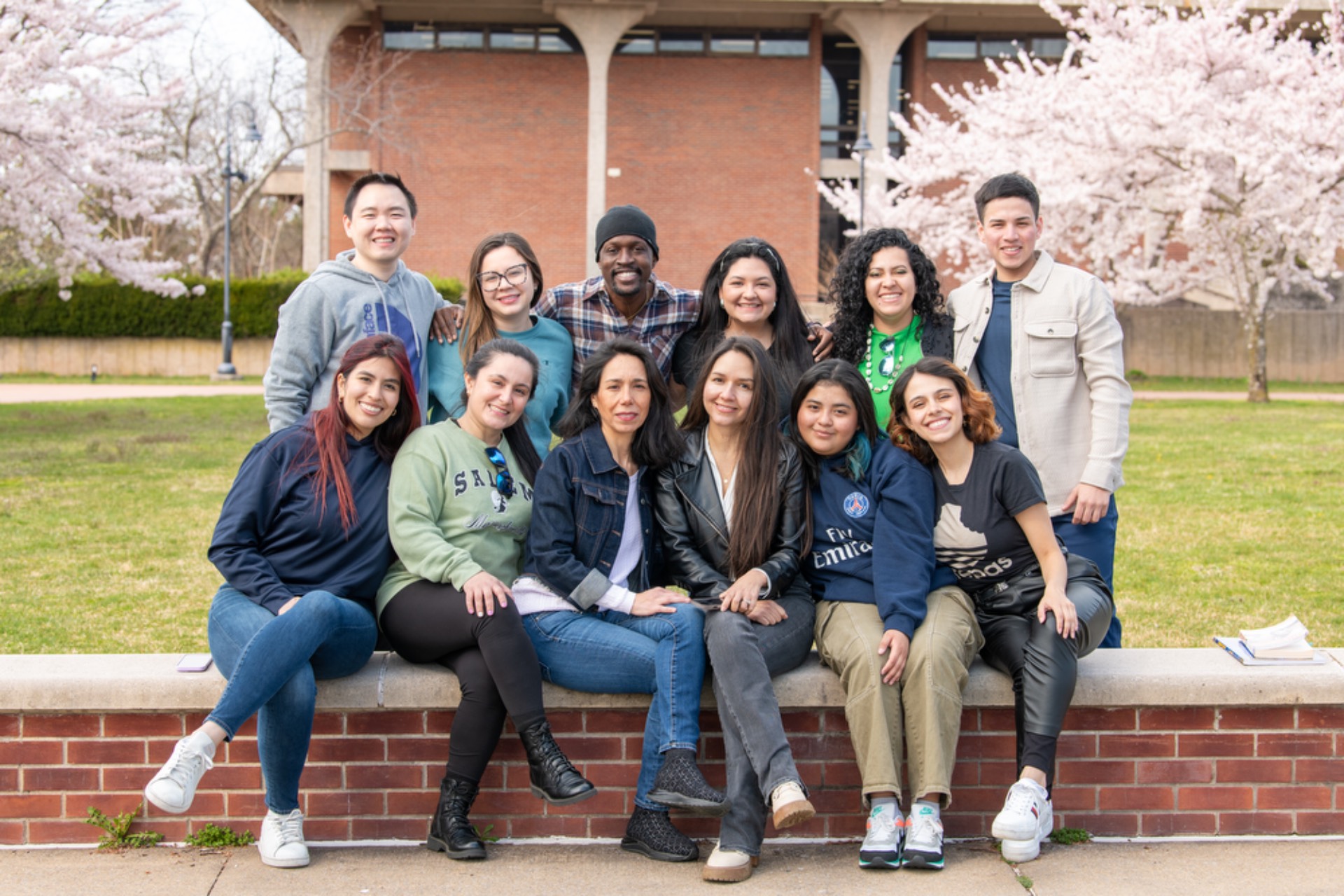 Students at the clock tower on the Ammerman Campus.