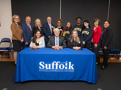 Photo Caption: Back row: (L to R) Dr. Donna Ciampa, Suffolk’s Interim Executive Dean, Michael J. Grant Campus;  Dr. Hector Sepulveda, Suffolk’s Campus Associate Dean of Academic Affairs, Michael J. Grant Campus; Dr. Irene Rios, Suffolk’s Executive Dean, Ammerman Campus; John McLoughlin, Executive Director, Enrollment Partnerships, St. George’s University; Athalie Alexander-Arrington, Associate Director of Admissions, St. George’s University; Iris Rodriguez (student) Vet Track;  Michael Hector (student) Pharma Track; Jade Tordas (student) Medical Track; and representing St. John’s University’s College of Pharmacy and Health Sciences, one of Binghamton’s partnering institutions, Amy Wolfinger and Melissa Mirabella. Front row: (L to R): Laura Bruno, Vice President & Dean of Enrollment, St. George’s University; Dr. Edward Bonahue, President, Suffolk County Community College; and Maja Szostak, Director of Admissions, School of Pharmacy & Pharmaceutical Sciences - Binghamton University. 