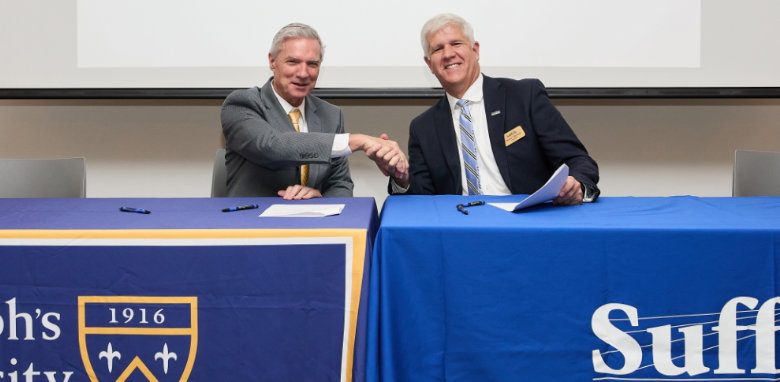 Suffolk President Dr. Edward T. Bonahue (pictured on the right in the photo with St. Joseph’s University President Dr. Donald R. Boomgaarden) 